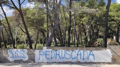Pintada en la pared de Sa Pedruscada: SALVEM-LA!